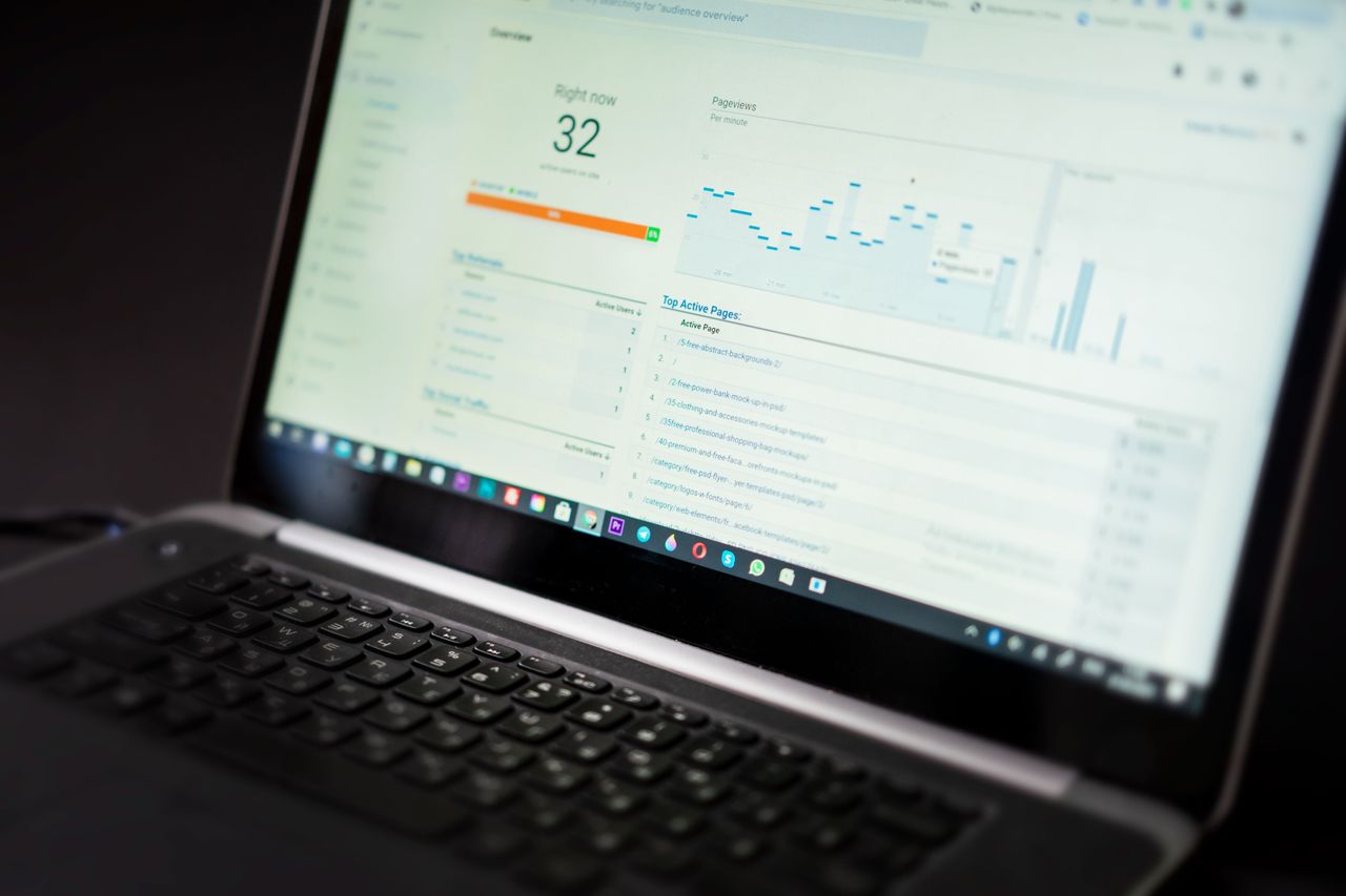 about-us-01 A laptop displaying an analytics dashboard with real-time data tracking and analysis tools.